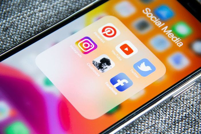 Title: phone - Description: Smartphone showing a folder of social media apps
