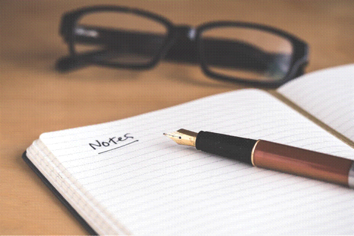 Title: Open notebook with a fountain pen, ready for a list of username ideas - Description: Open notebook with a fountain pen, ready for a list of username ideas