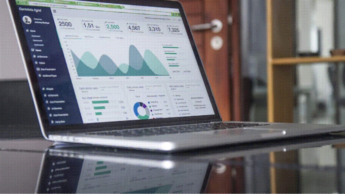 Title: Laptop screen showing an analytics dashboard with traffic graphs and performance charts - Description: Laptop screen showing an analytics dashboard with traffic graphs and performance charts