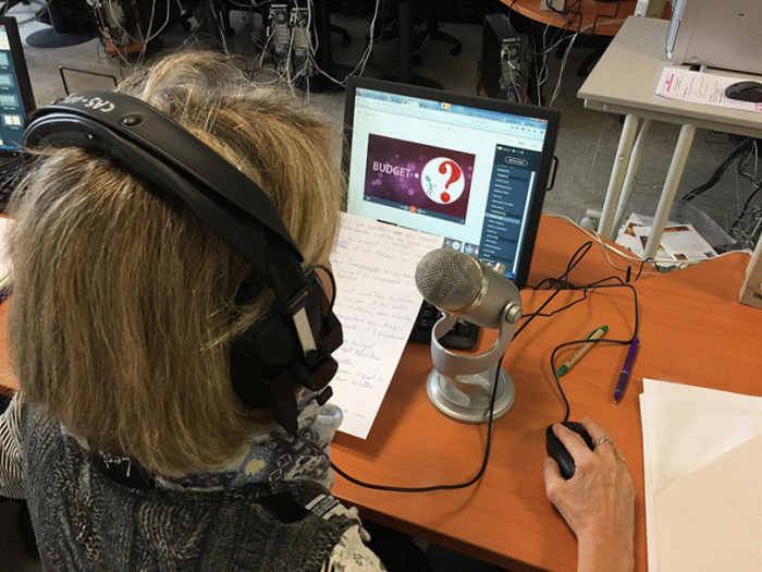 Title: Handwritten notes next to a microphone. Write the payoff line first and the rest of the page fills in faster than any outline. - Description: Handwritten notes next to a microphone. Write the payoff line first and the rest of the page fills in faster than any outline.